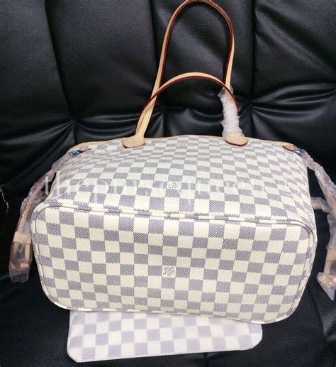 how to spot a fake damier louis vuitton bag|Louis Vuitton checkered tote bag.